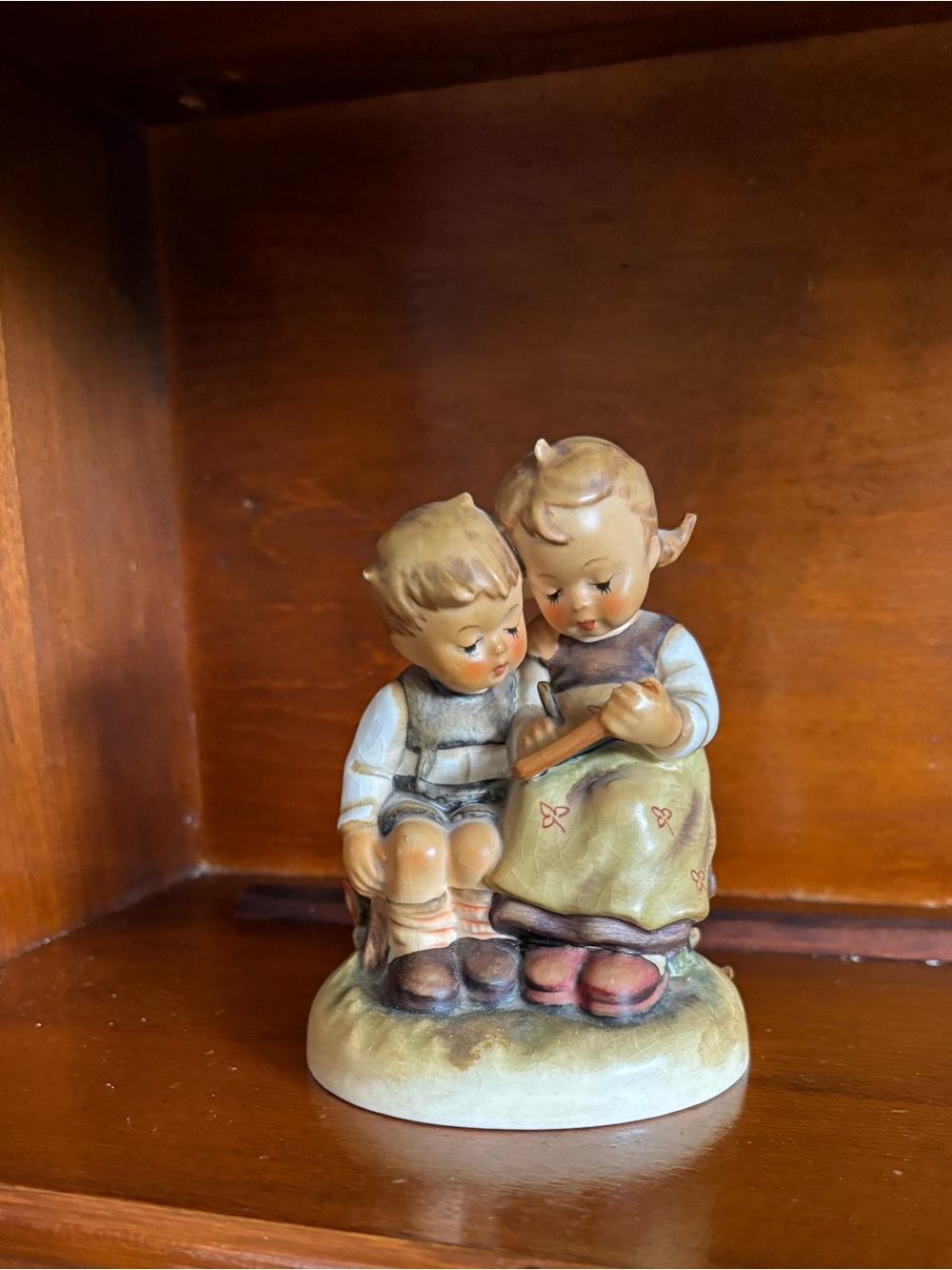 Hummel Porcelain Figurine of Two Children in Pastel Greens and Browns